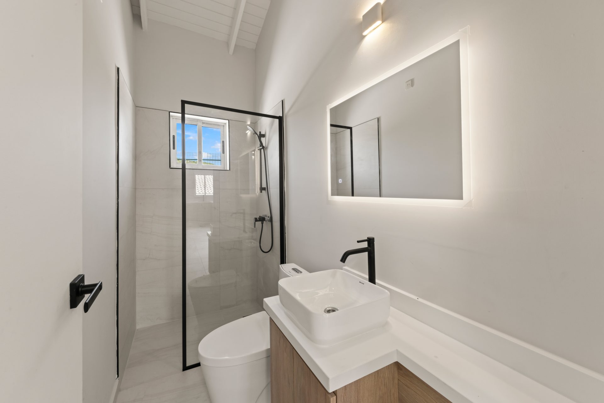 Curaçao real estate, Airbnb-ready bungalow for sale featuring stylish bathroom with walk-in shower