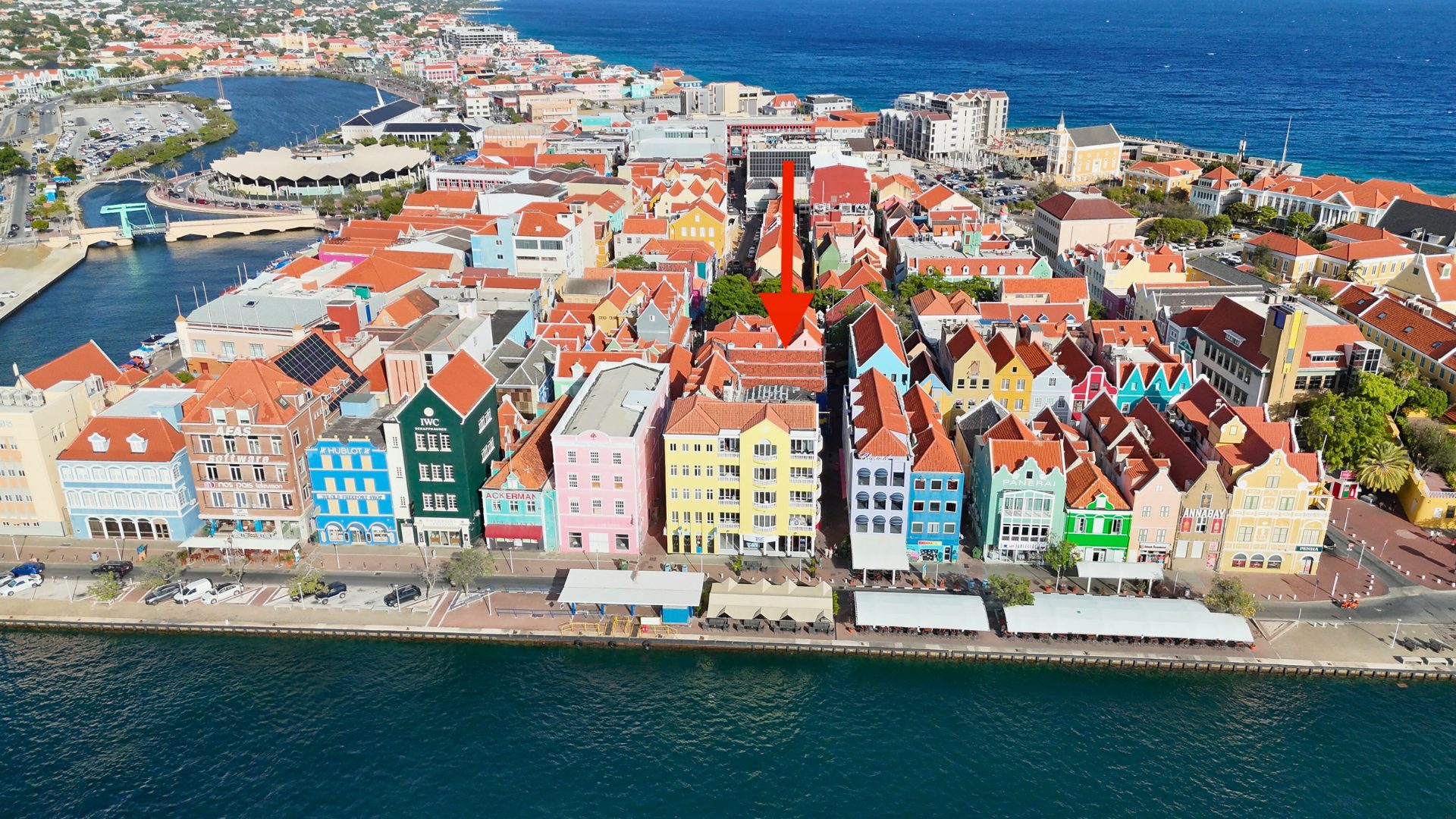 Aerial view of colorful buildings in Punda, Curaçao, highlighting a versatile commercial property for sale, with the waterfront and vibrant architecture.