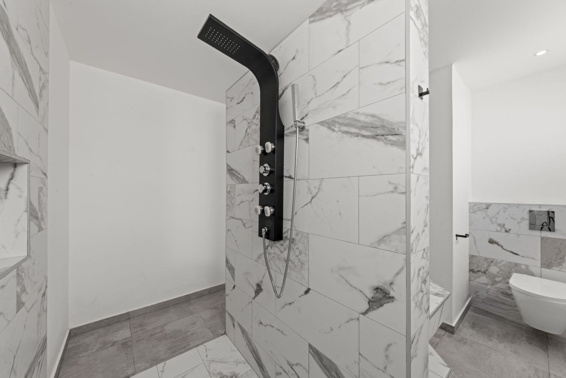 for sale in curaçao real estate in turnkey villa in Vredenberg bathroom with marble finish and glass shower