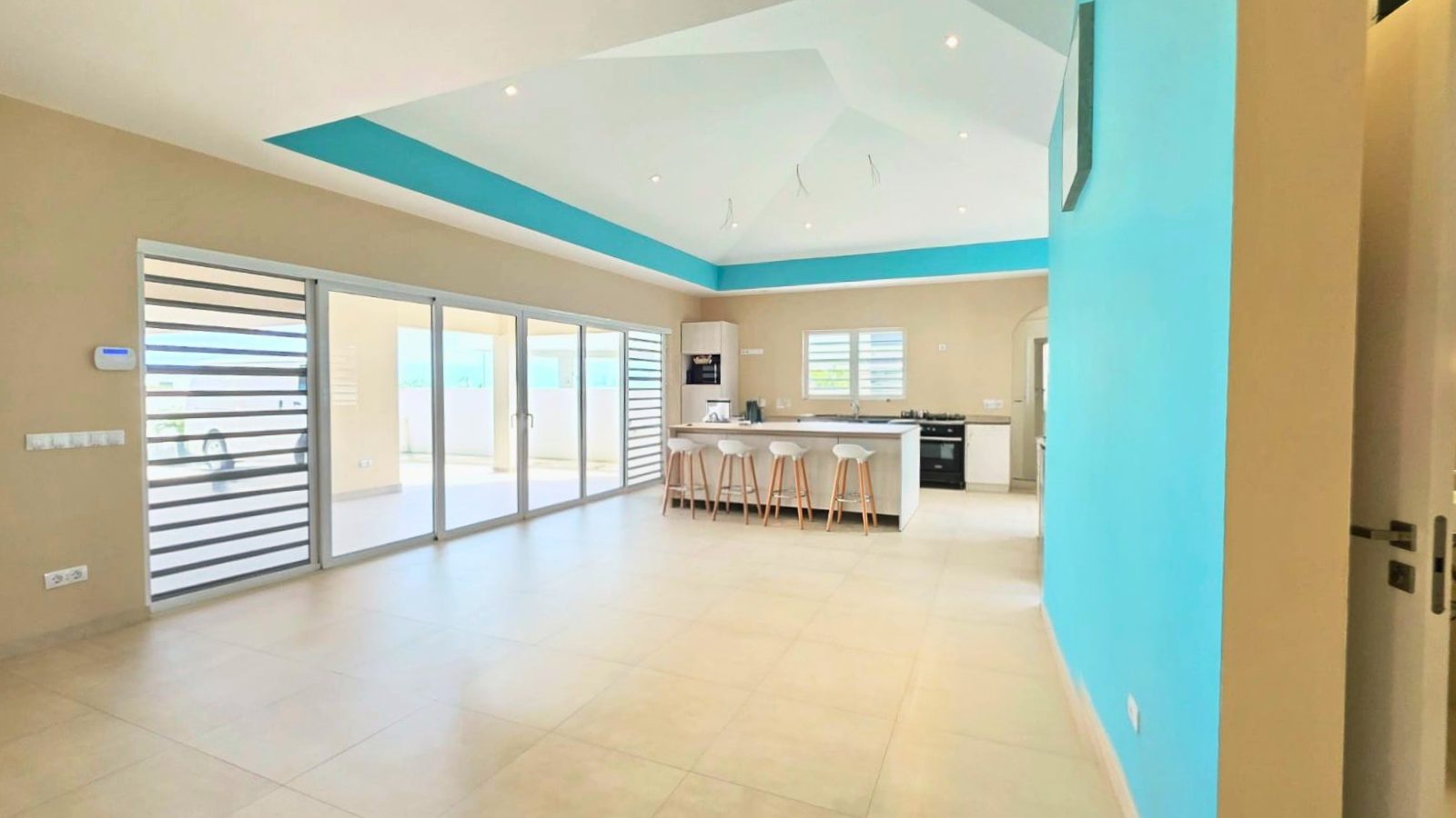 villa for sale in curaçao real estate at Harmonie modern kitchen and living space with clean lines and open layout