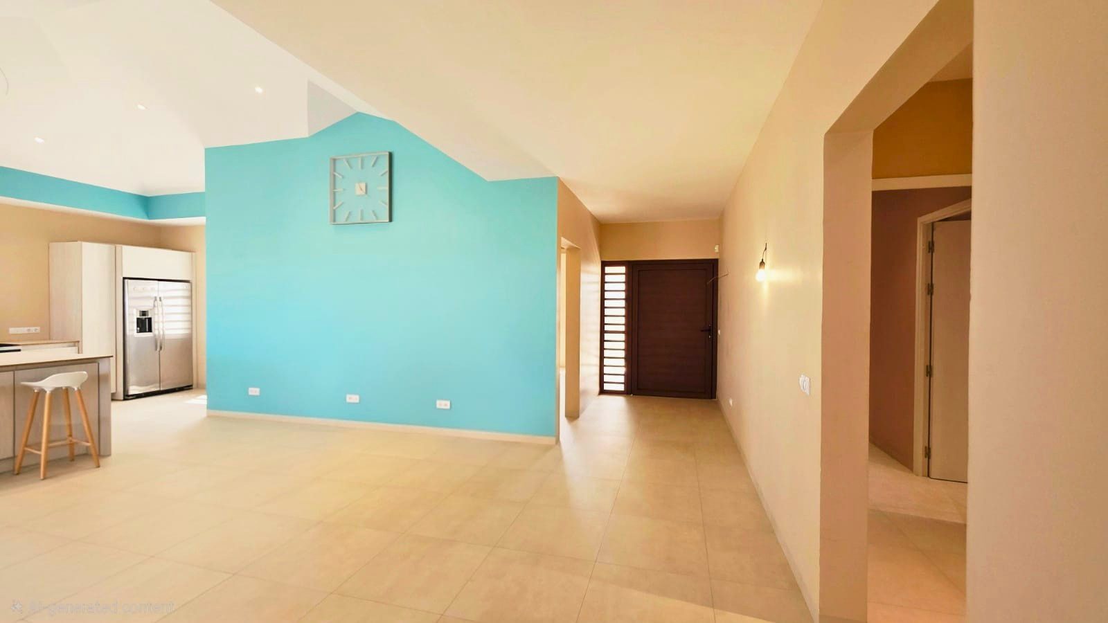 villa for sale in curaçao real estate at Harmonie bright living room with high ceilings and turquoise accent wall