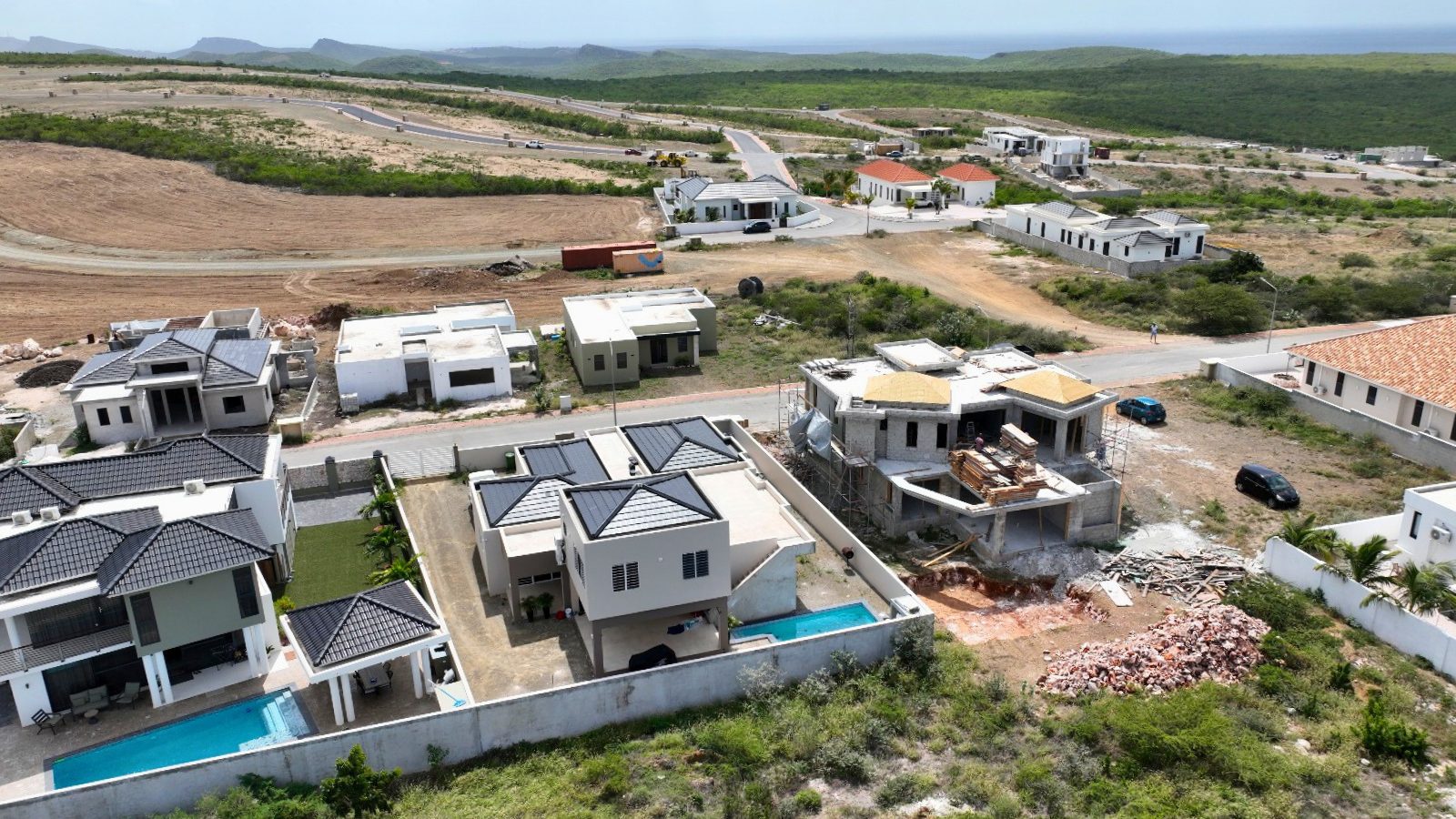 villa for sale in curaçao real estate at Harmonie newly built homes in developing neighborhood with surrounding landscape