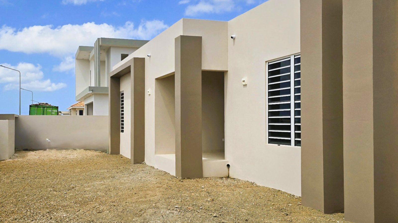 villa for sale in curaçao real estate at Harmonie side exterior with clean lines and functional layout