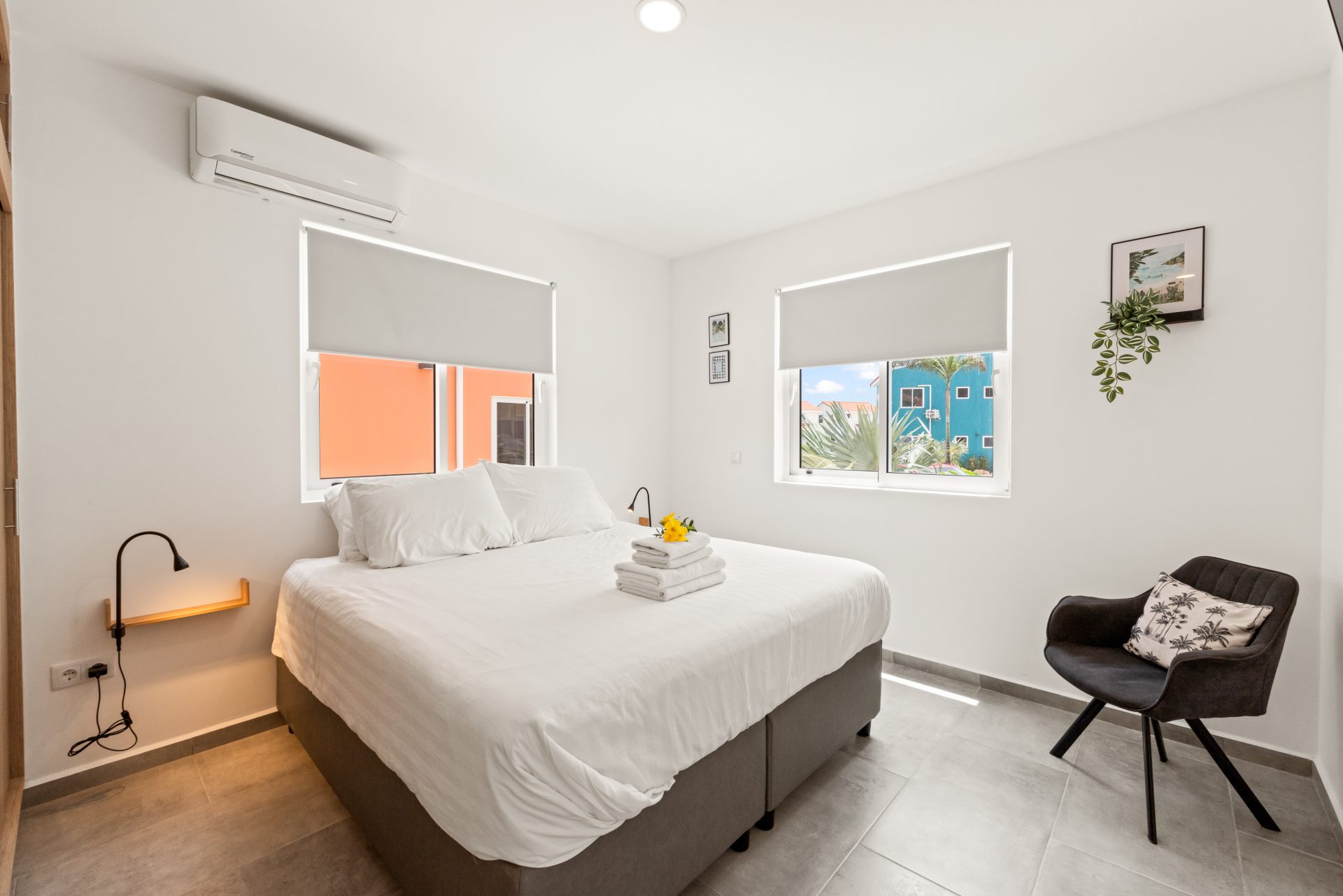 punta azul ocean resort unit for sale - bedroom with large windows and minimalist decor
